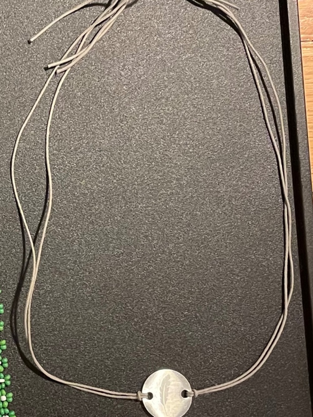 21" String choker with feather charm